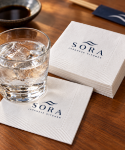 Illustrative custom restaurant branding on disposable paper napkins