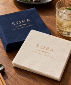 Illustrative custom restaurant branding on disposable paper napkins