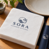 Illustrative custom restaurant branding on disposable paper napkins
