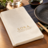 Illustrative custom restaurant branding on disposable paper napkins