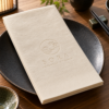 Illustrative custom restaurant branding on disposable paper napkins