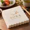 Illustrative custom restaurant branding on disposable paper napkins